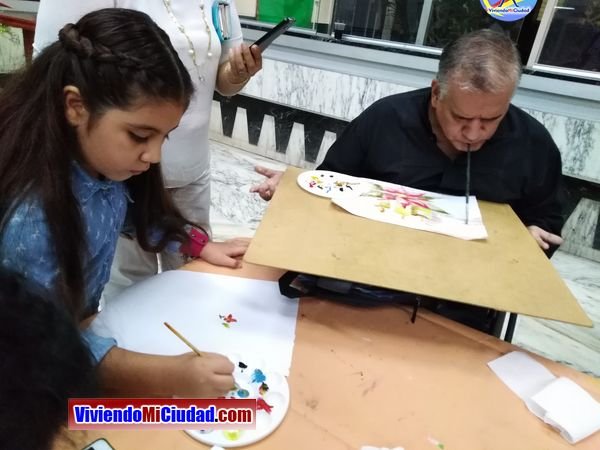 Joel Ramos en el Dia Munidal Pintor Boca y Pie